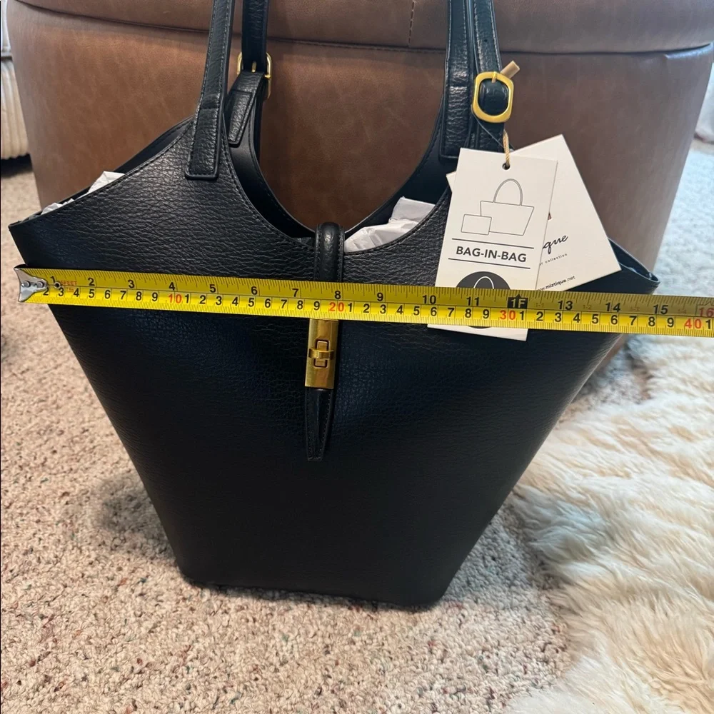 Miztique Black leather tote bag with gold hardware. Compartment bag.